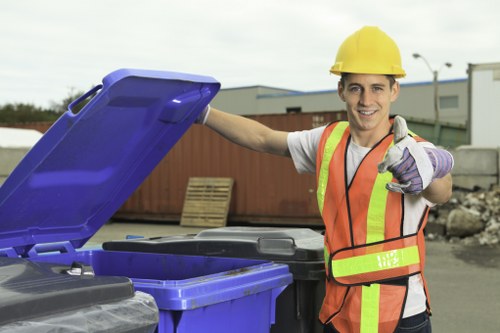 Team reviewing hazardous waste containment before collection